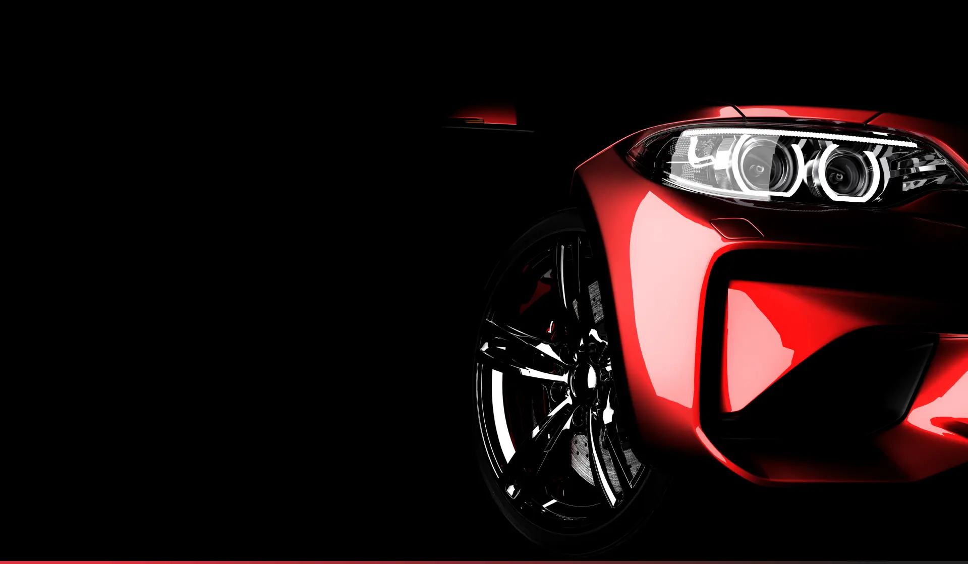 Sleek red sports car with bright headlights